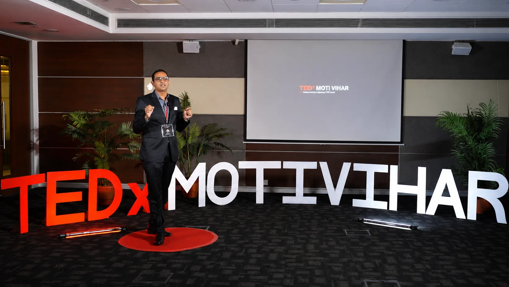 Raja Pantham speaking on the TEDx Moti Vihar stage